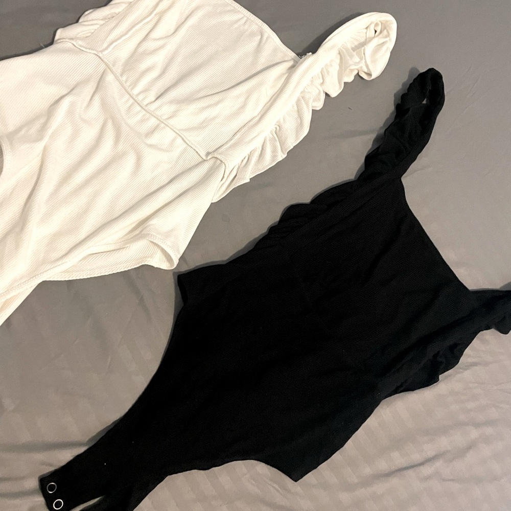 Brand new . Took tags off. Black or white. Deep v in back